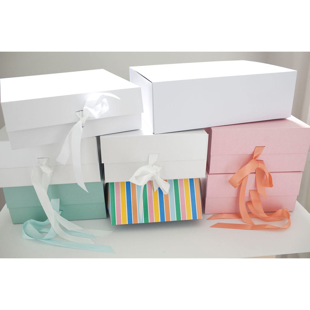 white and pink gift boxes